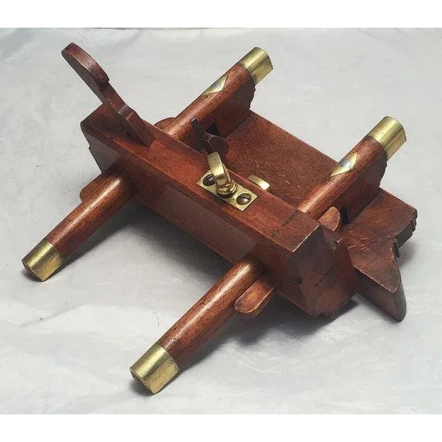 A fine English shipwright's or carpenter's sash fillister or plough plane, c.1900, of finely patinated beech wood and...