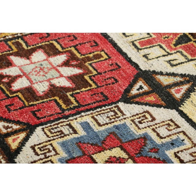 Hand-knotted in wool, this 2x3 classic oriental rug from Rug & Kilim showcases a vibrant composition of geometric and...