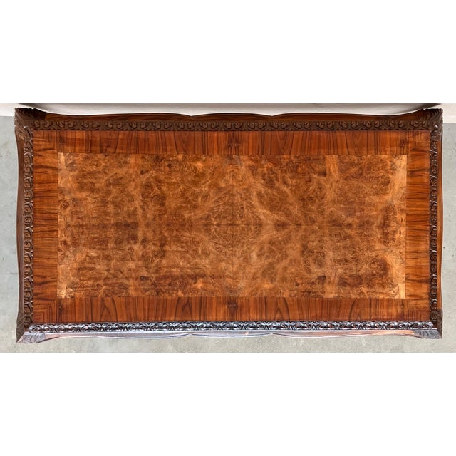 A fantastic antique walnut coffee table in the Queen Anne Style. This was made in England, it dates from around the...