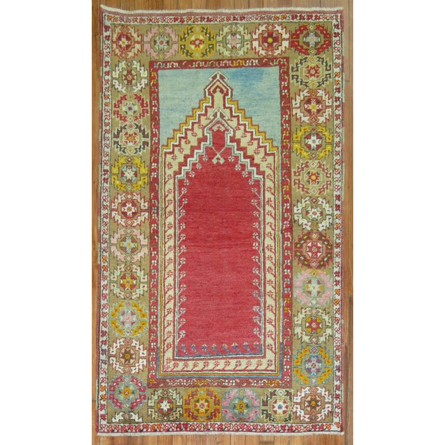 Mid 20th century colorful Turkish Melas rug in bright colors highlighted by a mihrab prayer niche design Measures: 3'3" x...