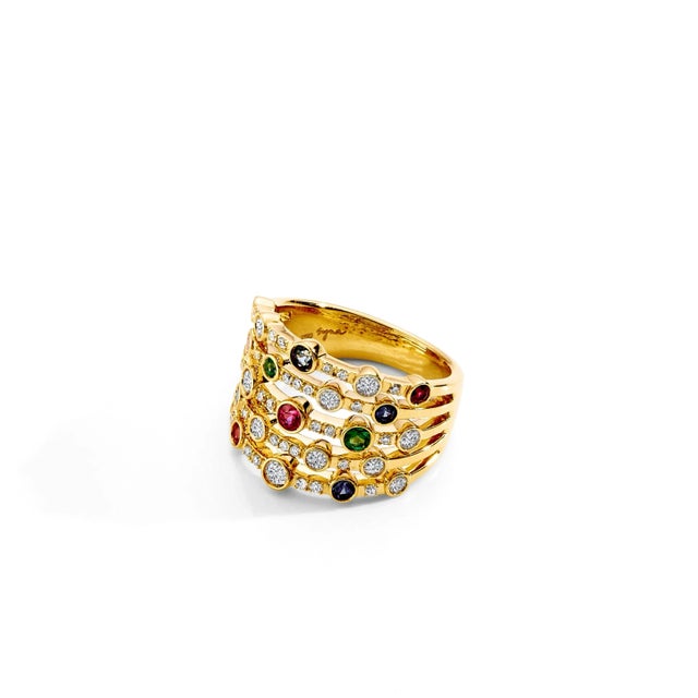 18 karat yellow gold Emeralds 0.10 carat approx. Rubies 0.20 carat approx. Blue Sapphires 0.20 carat approx. Diamonds 0.70...