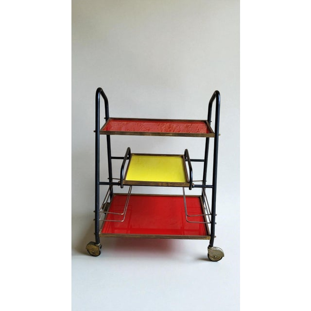 Vintage 1960s Red & Yellow Bar Cart Black lacquered tubular metal frame, gold metal frame, glass shelves. Height 85 cm...