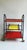 Vintage 1960s Red & Yellow Bar Cart Black lacquered tubular metal frame, gold metal frame, glass shelves. Height 85 cm...