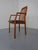 Armchair by Dyrlund in solid teak. Seat upholstered in brown leather. This piece has an attribution mark, I am sure that...