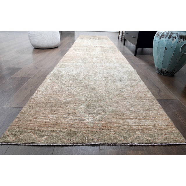 Vintage Persian Hand-Knotted runner rug is a semi-antique vintage runner rug. The '70s Eastern region of Anatolian's...
