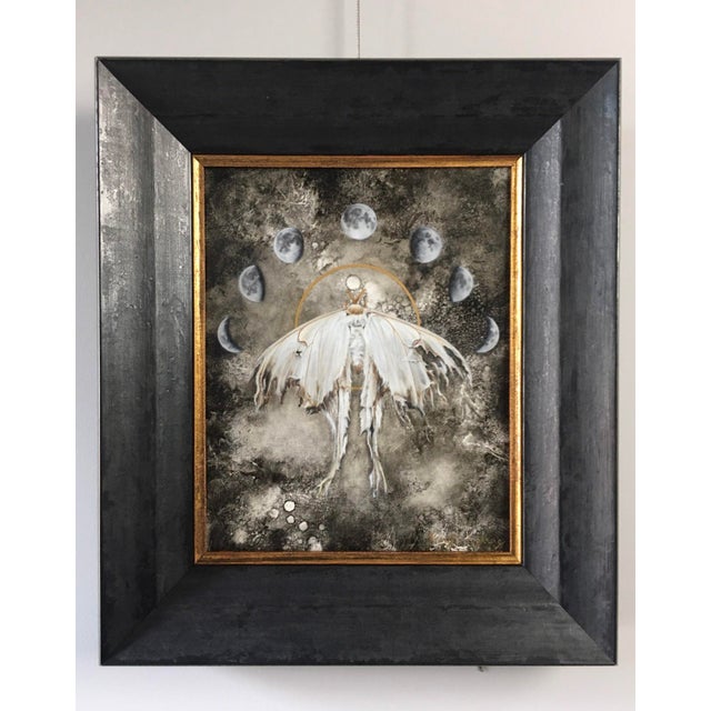 Luna depicts a mystical figure with ethereal wings, enveloped in a muted palette that evokes a sense of serenity and...