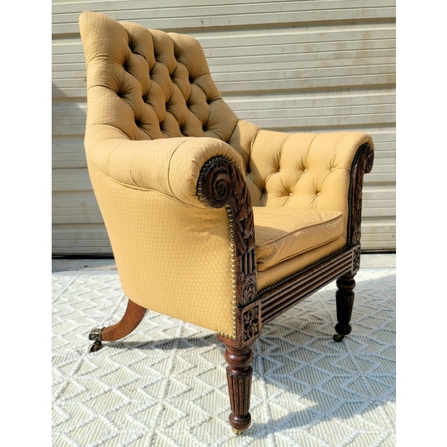 Featured is a glorious Antique 19th Century Carved Mahogany Regency Library Chair in the manner of Gillows of Lancaster...