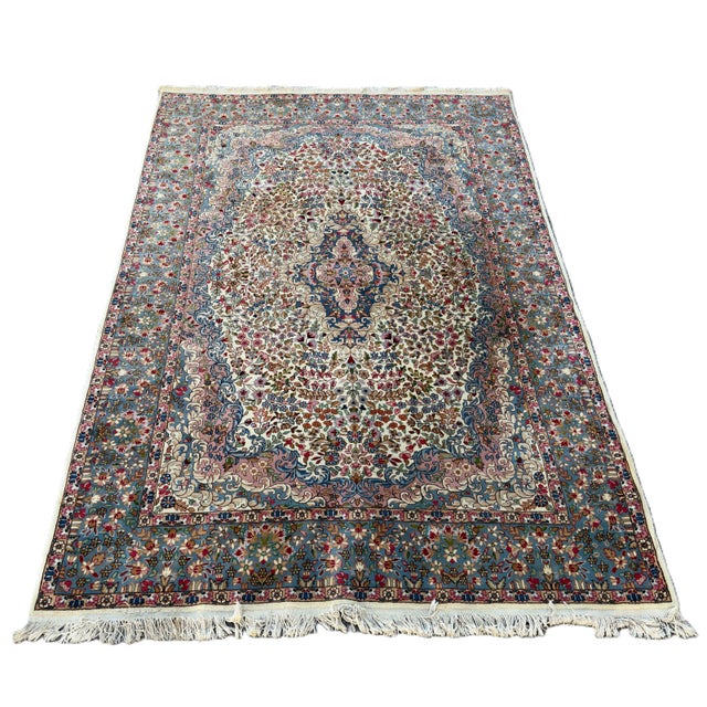 An imposing and refined large rug with a luminous decorative scheme, attributed to the famous 20th-century Kashan...