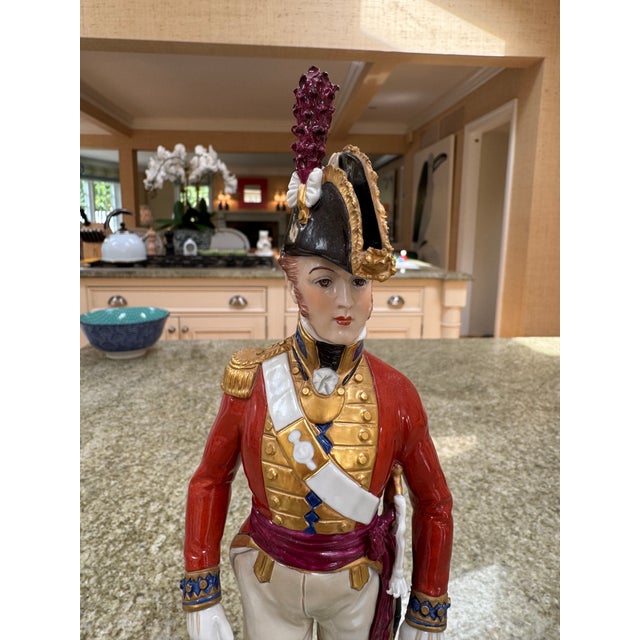 A perfect Sitzendorf German porcelain figure of a soldier of the Grenadier guards.