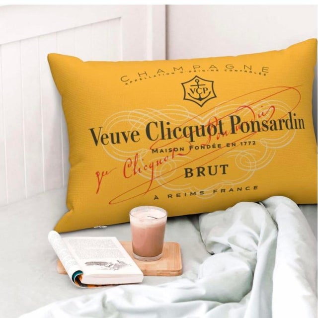 Large 20x30 lumbar pillow displaying back and front the famous French Champagne label. Veuve Clicquot Ponsardin is a...