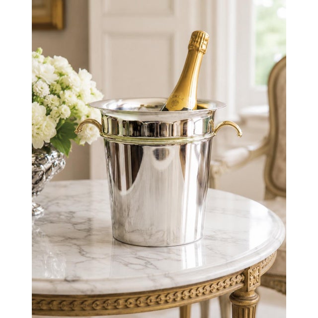 A fabulous Mid-Century French Art Deco style silver plated champagne ice bucket or wine cooler with brass handles. Maker's...