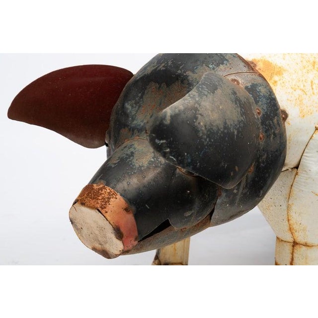 Mid 20thc Full-bodied pig standing on four legs and having a curly tail. Black and white paint.