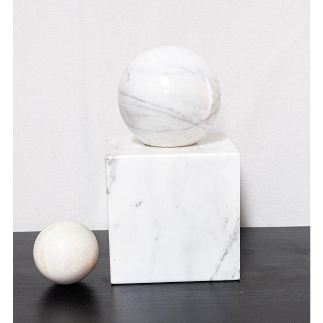 Presented is a Mid-Century Marble Square solid pedestal base with two sizes of Round Marble spheres. The larger sphere has...