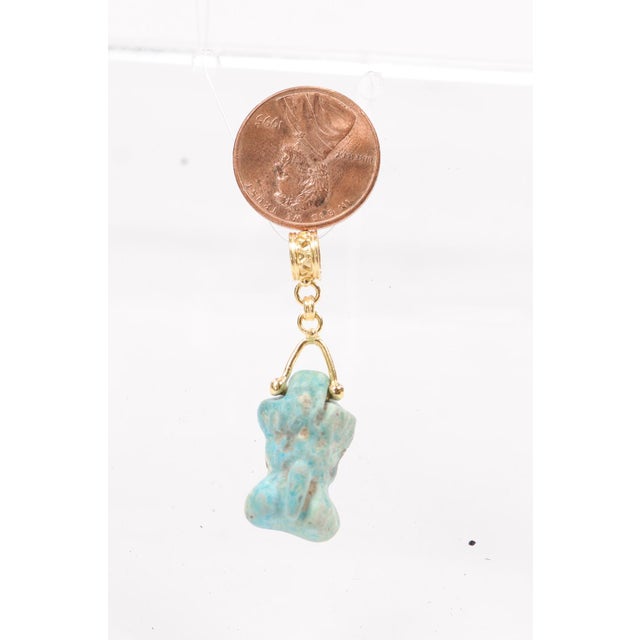 An Egyptian Faience Charm set in 21 karat gold as a Pendant. Faience is considered "early glass" and was used often in...