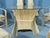 Odd rattan bases with woven faux leather seats with high backs. Table has rattan base with oval glass top. 2 arm chairs...