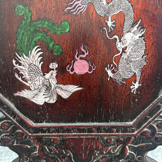 This handsome vintage Chinese octagonal table screen is handcrafted from rich rosewood, beautifully decorated with mother-...