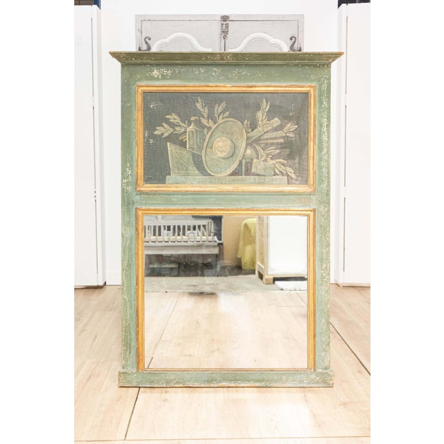 A French Louis XVI style painted trumeau mirror from the 19th century with Science allegory. This exquisite French Louis...