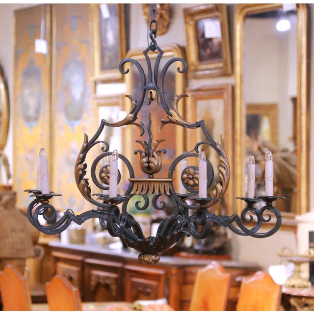 Bring elegant French character to a dining room, entry, or breakfast room with this antique wrought iron chandelier...
