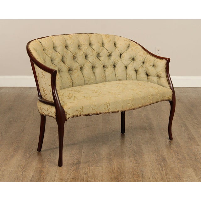 High Quality Regency Style Carved Mahogany Settee or Loveseat With Custom Tufted Floral Upholstery And Tack Trim Detail....