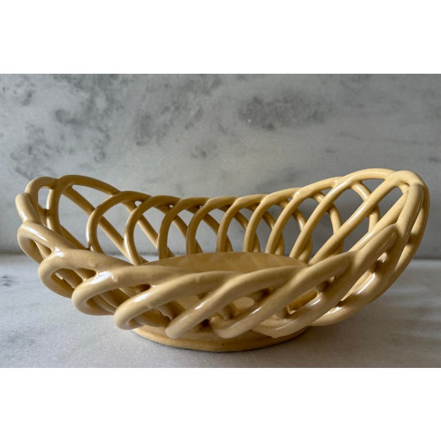 Vintage handmade ceramic open-weave lattice bread basket or fruit bowl with a braided rope or wicker look. Marked with an...