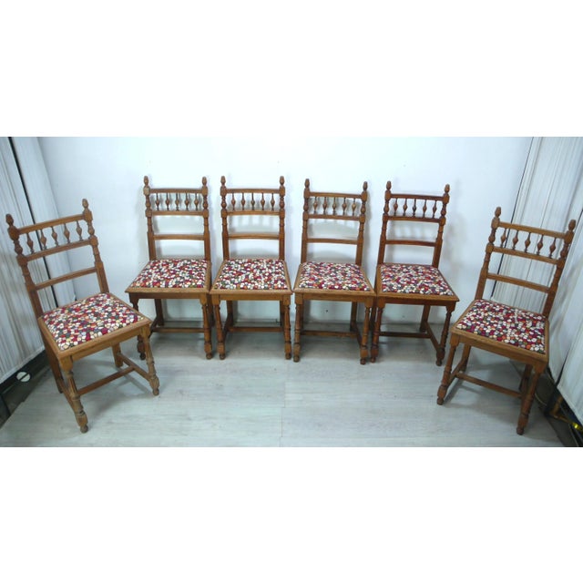 Set of 6 antique dining room chairs in natural oak, newly upholstered with a colorful earth-tone mosaic cover, which...