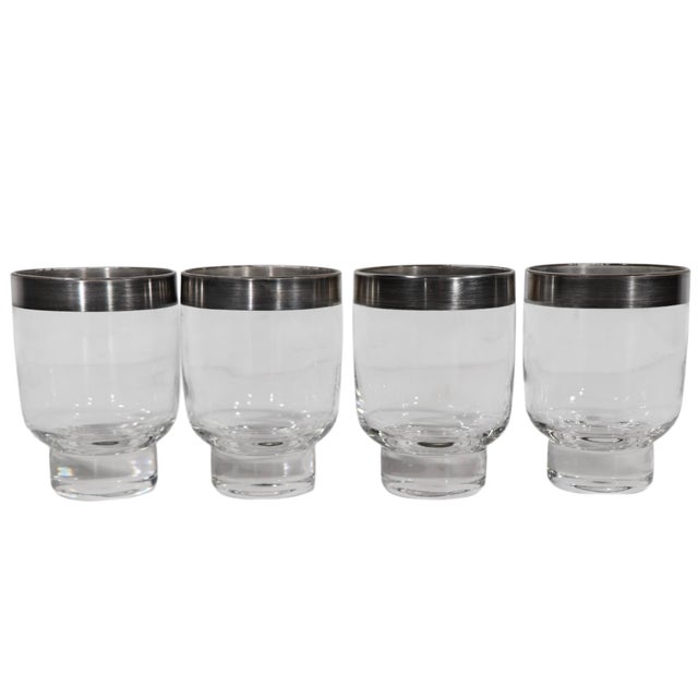 Set of four mid century silver rimed drinking glasses, in the style of Dorothy Thorpe. All four are in very good,...