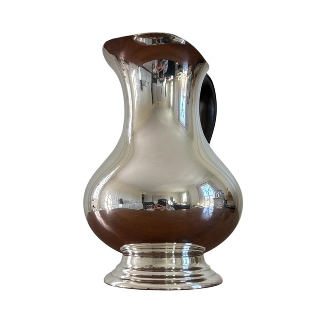 - Silver-plated - Size: 7.5"W x 6"D x 8.5"H - Dark brown scrolling handle (possibly Bakelite) - Very elegant and beautiful...