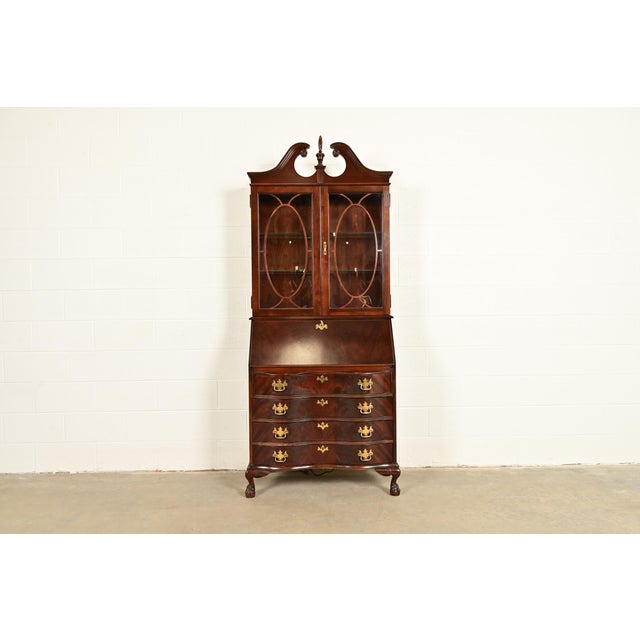 An outstanding Chippendale or Georgian style bureau with drop front secretary desk and lighted bookcase hutch top In the...