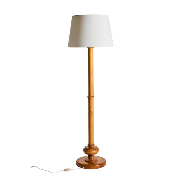 A beautifully crafted floor lamp in solid pine, Sweden, circa 1960s-70s. An elegant example of Scandinavian artisan...