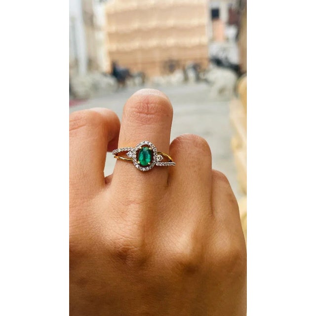 This is part of Chairish’s Fine Jewelry assortment. Emerald and Diamond Engagement Ring in 18K Gold featuring natural...