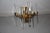 This Sciolari sconce of minimal design is made of gilt brass. Up to 250V (Europe/UK Standard).The wiring of this item may...