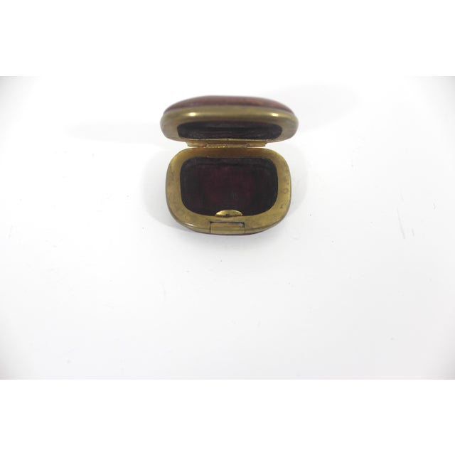 Vintage leather and brass pill box. There is patina on the leather and brass, as seen in the photos. Hinge and clasp work...