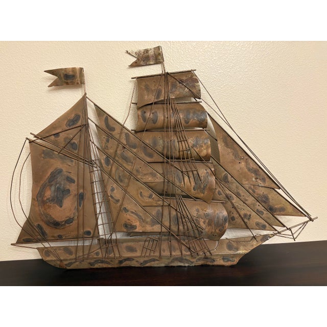 This wonderful old sculpture is referred to as Brutalist style art, particular this old metal that's hinged together piece...