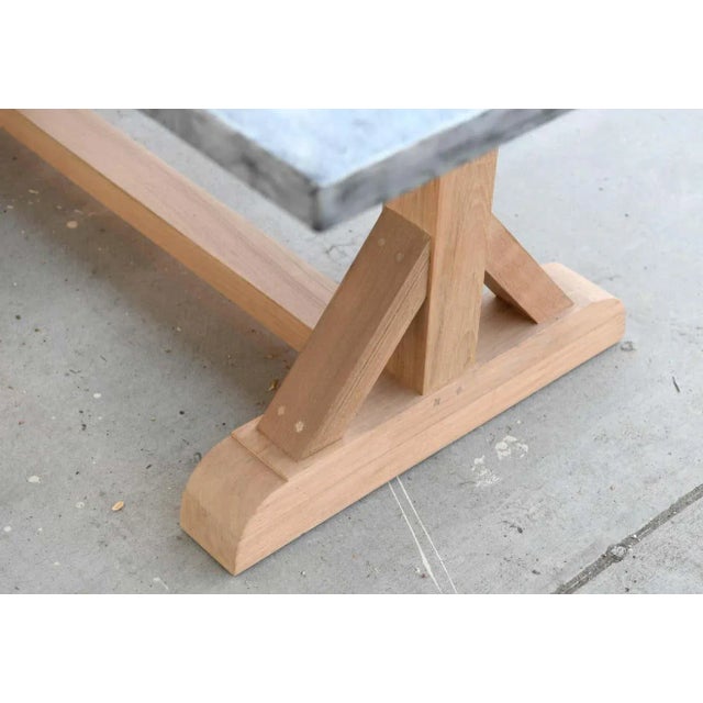 Designed to withstand any climate, this zinc top teak table is seen here in 120" x 40". In this particular piece the teak...