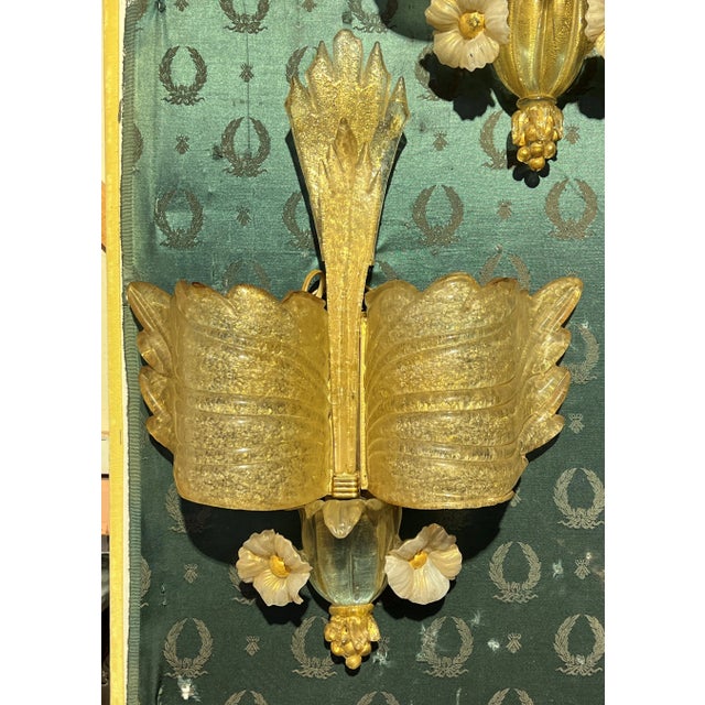 Pair of vintage mid-century period Murano glass sconces hand-blown from gold-infused clear and white glass, with butterfly...