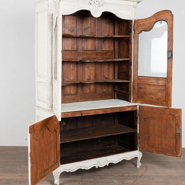19th century French vitrine crafted in pine with a newer professionally applied layered light gray painted finish. Antique...