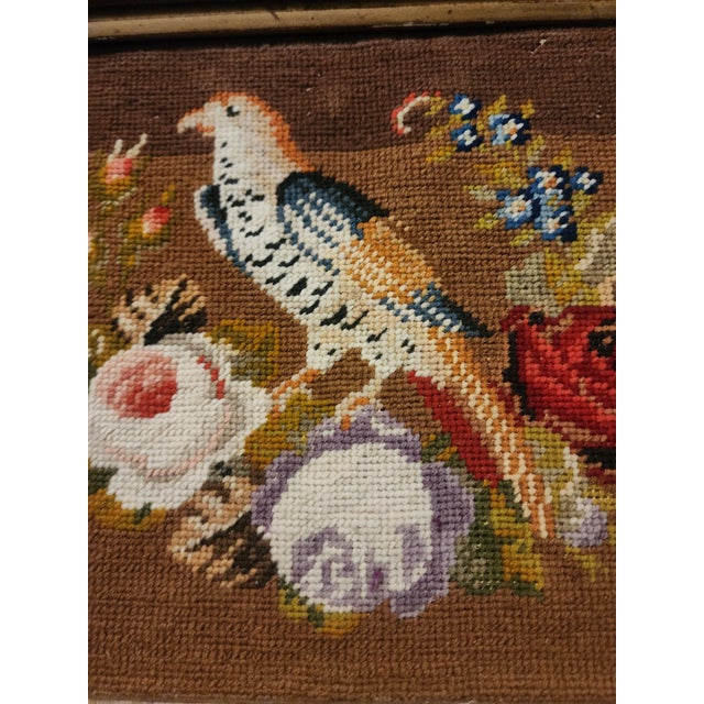 Charming vintage gold and brown square framed Needlepoint textile of a bird and flowers.