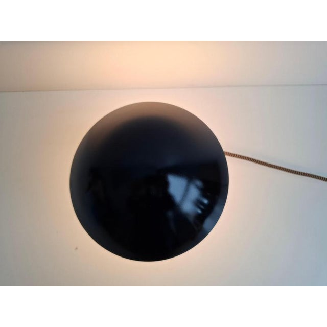 An original bauhaus-style mushroom table lamp produced in czechoslovakia circa the 1930s. The lamp features a black dome...