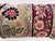 Decorative pillow upholstered in a 19th century Kerman rug fragment, featuring charming floral flowerhead motifs and an...