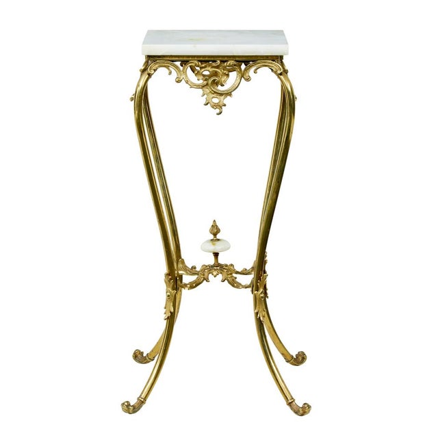 20th century chiseled brass and oynx pedestal table circa 1930. Very much in the rococo taste ornate french pedestal table...