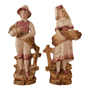 Pair of Early 1900s Continental Majolica German Boy and Girl Figurines