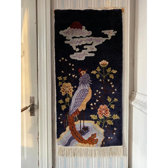 This exquisite dense and hand-knotted Baotou (sometimes spelled Paotou or Paotow) rug features a deep blue background...