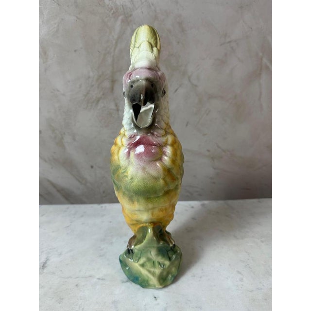 A rare and authentic slipware pitcher depicting a parrot, made by the Saint-Clément factory and dating from the 1920s....