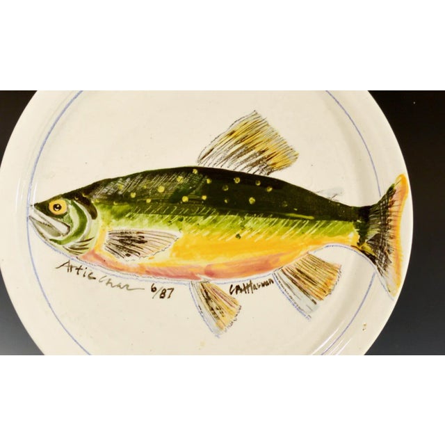 Carole Moses Harman Hand-Painted Pottery Dish, Arctic Char, Dated 1987 American, dated June 1987 This large circular...