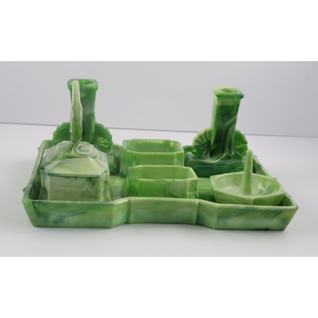 This is the kind of vanity set that instantly elevates a space. The rich green slag glass catches the light beautifully,...