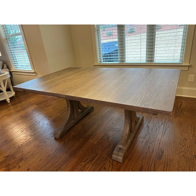 Brand new (2025) Ethan Allen Corin Trestle Extension Dining Table in "Porcini" finish. Medium-gray-brown stain with light...