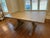 Brand new (2025) Ethan Allen Corin Trestle Extension Dining Table in "Porcini" finish. Medium-gray-brown stain with light...