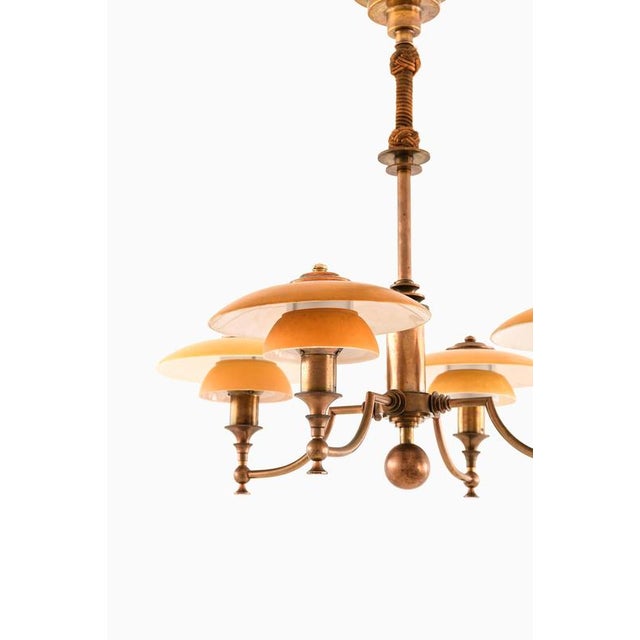 This very rare ceiling lamp, produced by lyfa in denmark during the 1930s, is a distinguished example of early...