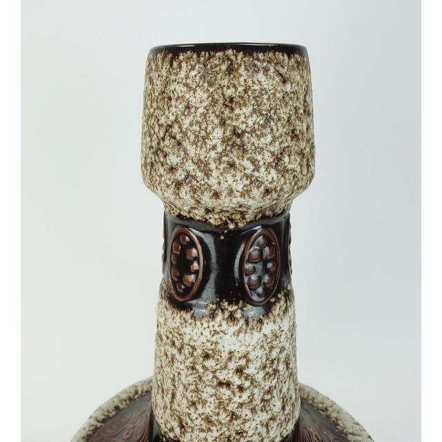 Impressive large floor vase from the 1970s. Beige-brown fat lava glaze, interspersed with ornamental decorative elements...