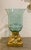 Large hurricane glass vase or centerpiece with gilt base. 11”w x 11”d x 19”h